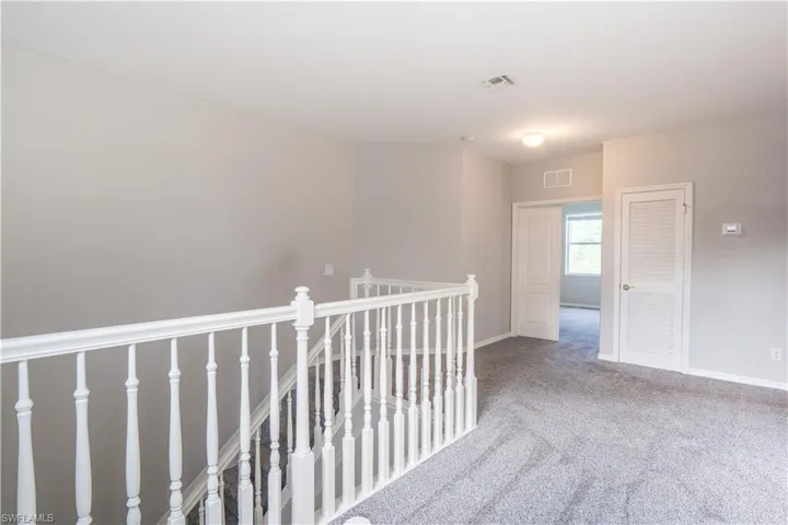 Small loft area with carpeted floors