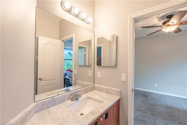 Jack and Jill Bathroom 2 featuring vanity and ceiling fan