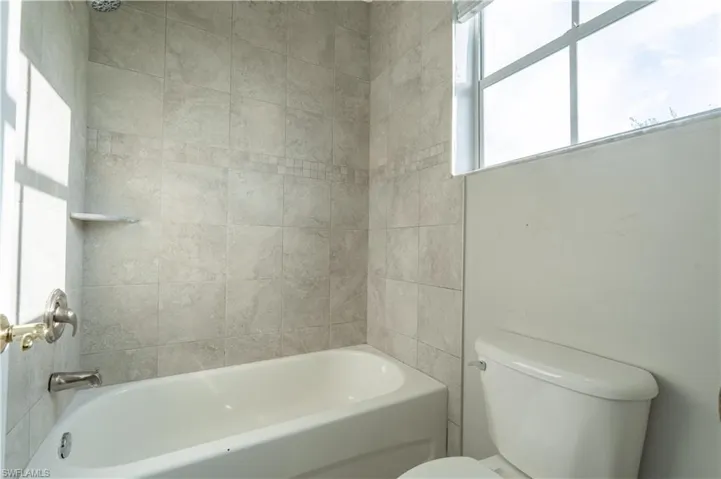 Bathroom with shower / tub combination