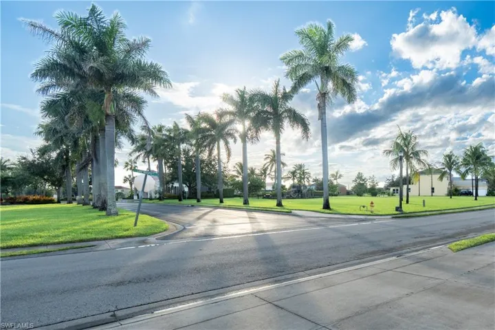 View of asphalt street with curbs and sidewalks