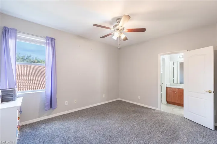 Unfurnished bedroom 2 featuring light colored carpet and ceiling fan