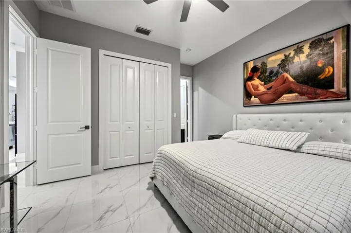 Spacious room featuring white panel doors, and bi-fold closet doors