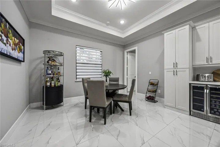 Dining area featuring crown molding, and recessed lighting