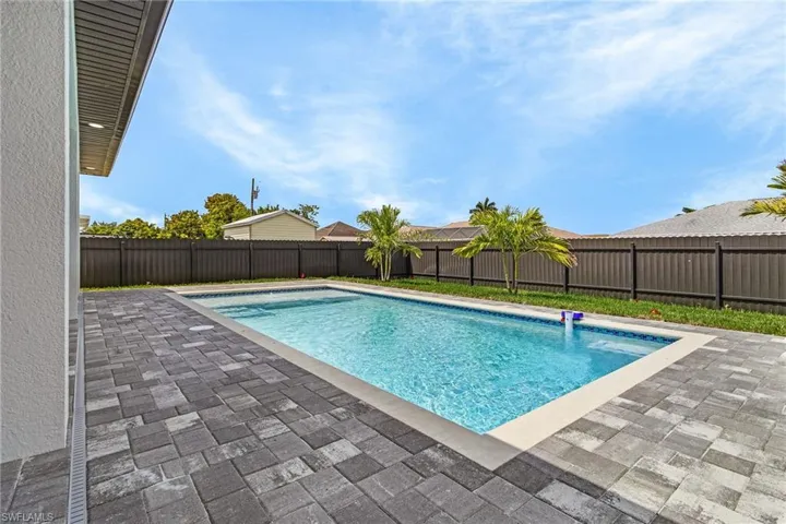 View of pool with a fenced in pool, a patio, and a fenced backyard
