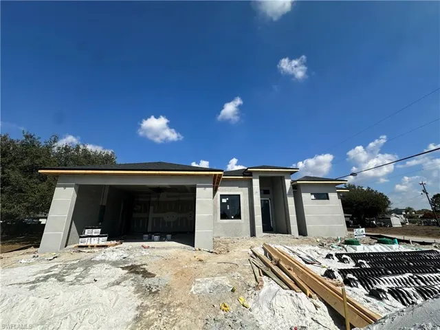 View of front of property with a patio