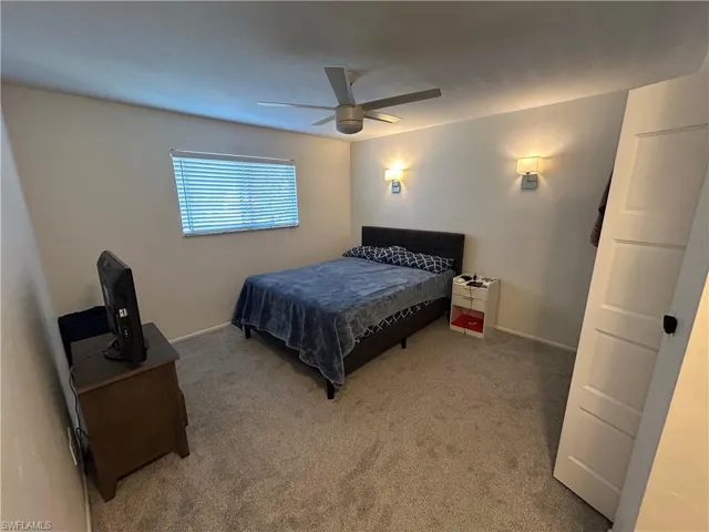 Bedroom with carpet and ceiling fan
