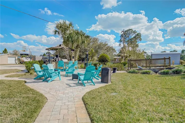 View of green lawn featuring a patio area