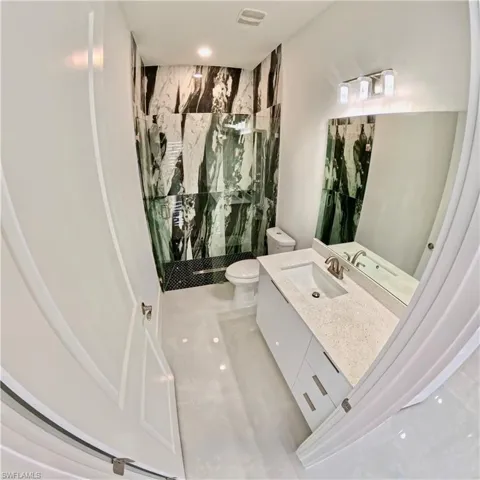 Bathroom with a walk in shower and vanity