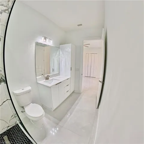 Bathroom with vanity and light tile patterned floors