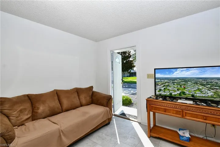 Living area featuring a textured ceiling