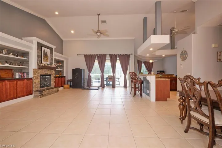 Upon entering your home you walk in to a very large open space which could be formal dining to the right, triple sliders straight ahead, kitchen off to the far right with dining behind.  Beautiful built ins and fireplace to the left.  Main bedroom/bath sits behind the fireplace and two bedrooms/laundry room and guest bath are behind the kitchen.  Nice open floor plan!