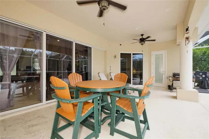 Lanai with pool bath.  Triple slider from living area, single slider from main bedroom and kitchen door all lead to the lanai.
