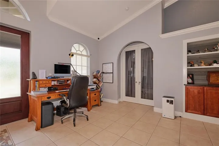 Current owners are using part of the entry as their office.  French doors lead to the main bedroom/bathroom. Lots of natural light in this home.