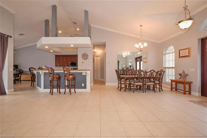 Another view of the open floor plan.  There is plenty of space in this living area.  Hallway between kitchen and dining leads to the laundry room, 2 additional bedrooms and guest bath.  Wait till you see the kitchen!