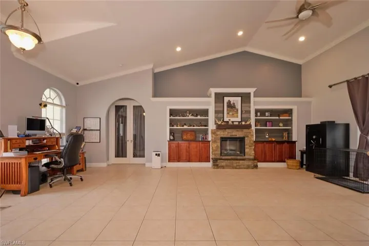 Another view of this beautiful open space.  Notice the rooflines.  That built in is gorgeous.  Space above to add more trinkets.