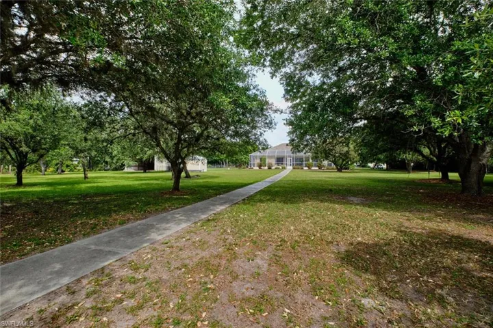 Walking path back to your home.  Imagine the barbeques you can have with this yard?
