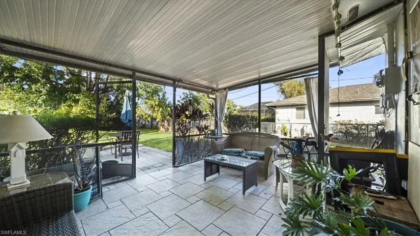 Sunroom / solarium with a patio area and outdoor lounge area