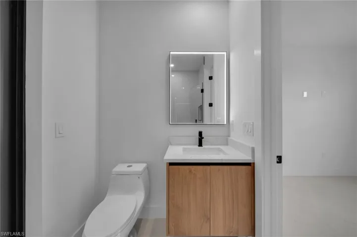 Bathroom with toilet and vanity