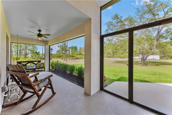 Sunroom featuring ceiling fan