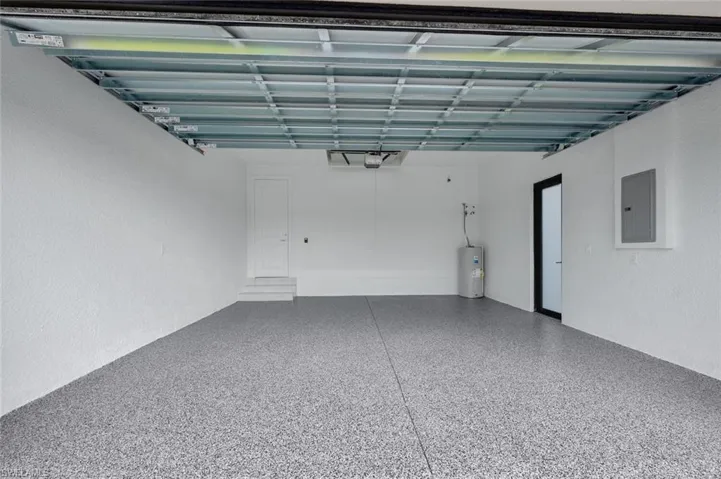 Garage with electric panel and water heater