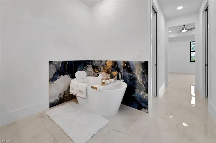 Interior details with ceiling fan and a bathing tub