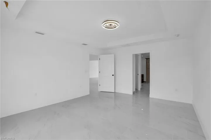 Spare room with light tile flooring