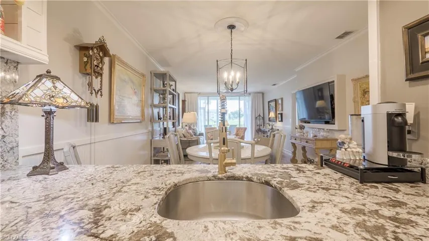 You will LOVE preparing meals and even doing dishes in this chef's dream kitchen. The view is unobstructed all the way to golf course!