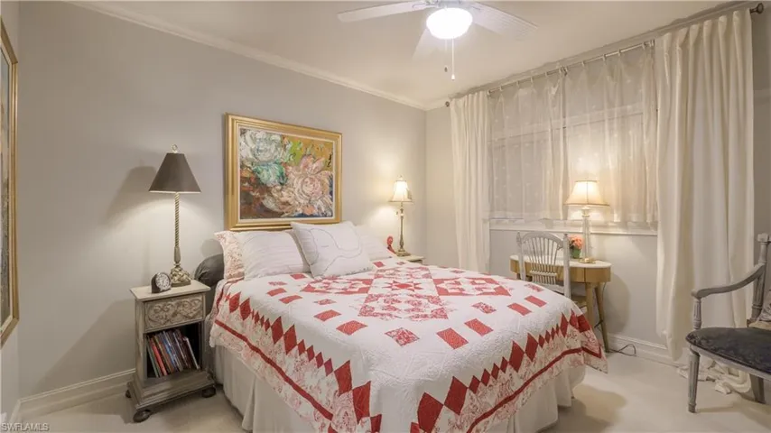 Your guests will enjoy their stay in this luxurious bedroom. Newer carpet, custom window blinds and curtains, and crown moulding enhance the coziness.