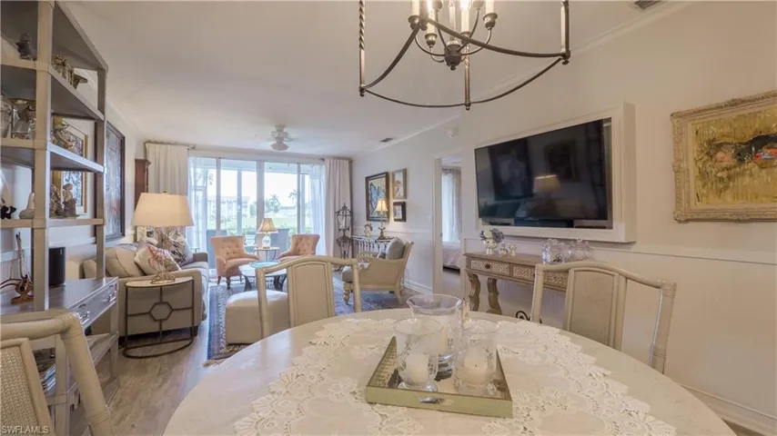 This is a view from the dining area. Golf course activity can be enjoyed from here, too. (Dining table and light fixture is different than pictured.)