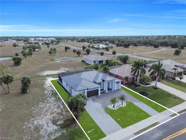 Aerial perspective of suburban area featuring property parcel outlined