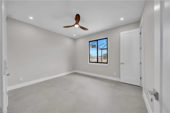 Unfurnished bedroom featuring a ceiling fan and recessed lighting