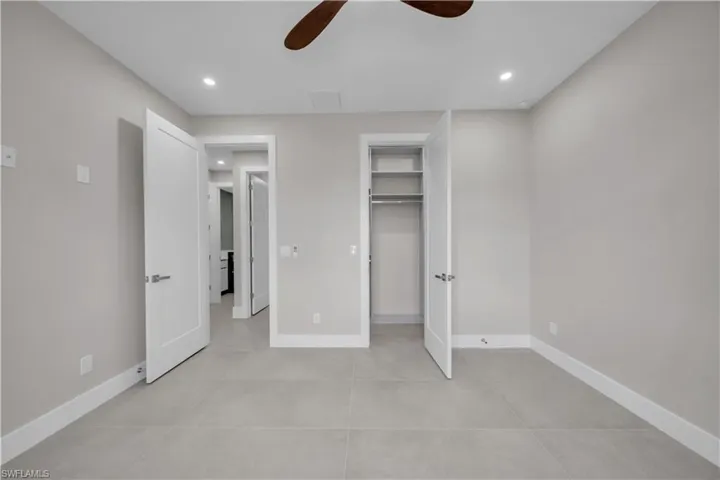 Unfurnished bedroom featuring recessed lighting and a ceiling fan