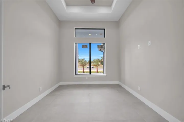 Empty room featuring baseboards