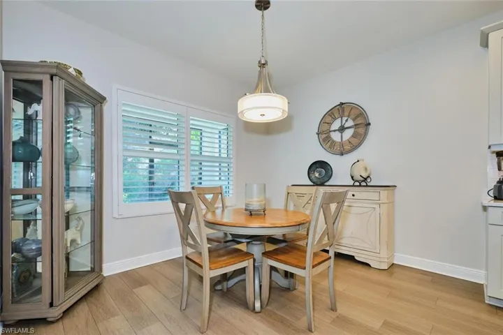 Dining room featuring light wood-type flooring and baseboards