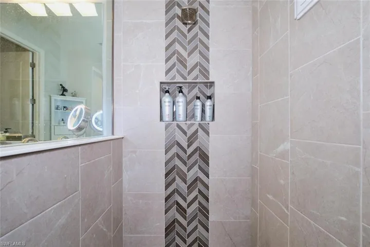 Full bath with a tile shower