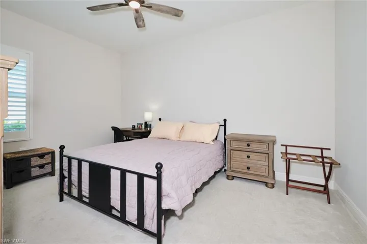 Bedroom with carpet and ceiling fan