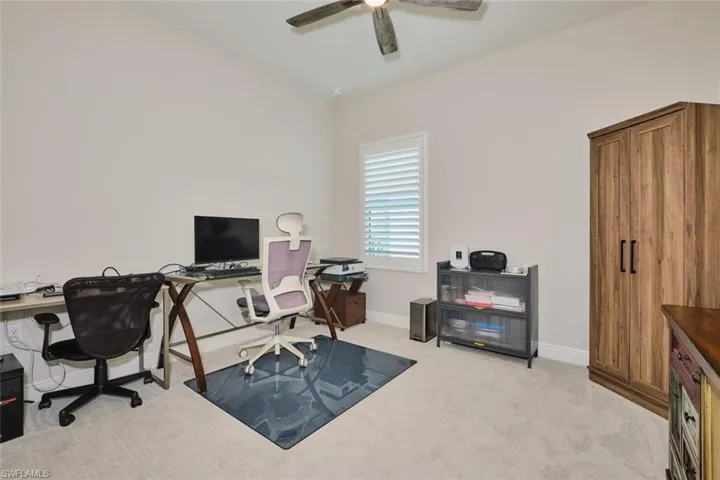 3rd Bedroom with light colored carpet and ceiling fan