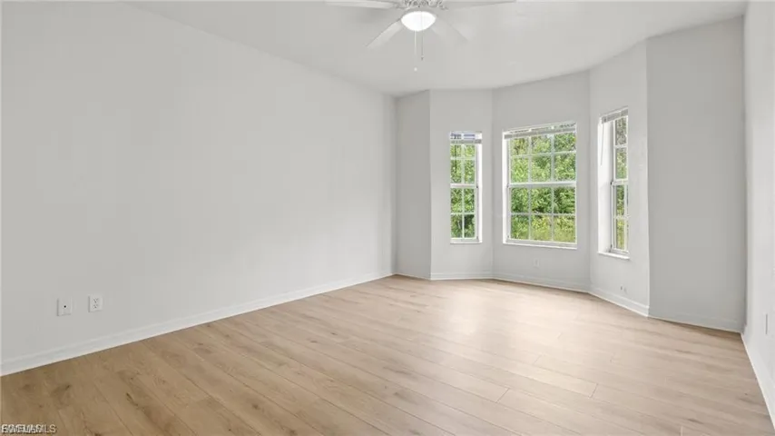 Spare room featuring light wood finished floors and ceiling fan