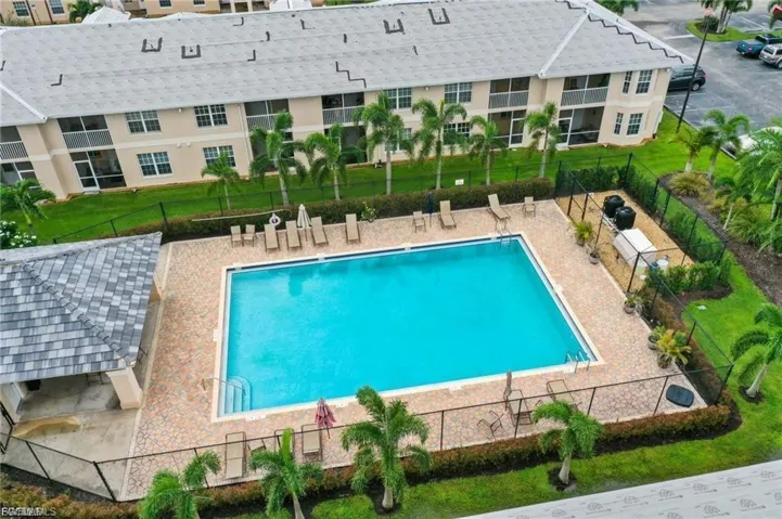 Community pool featuring a patio
