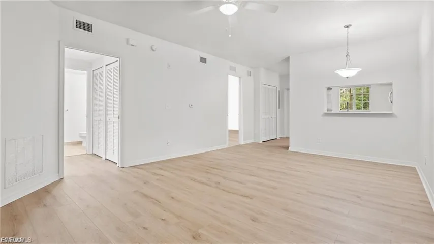 Unfurnished room with light wood-style flooring and ceiling fan