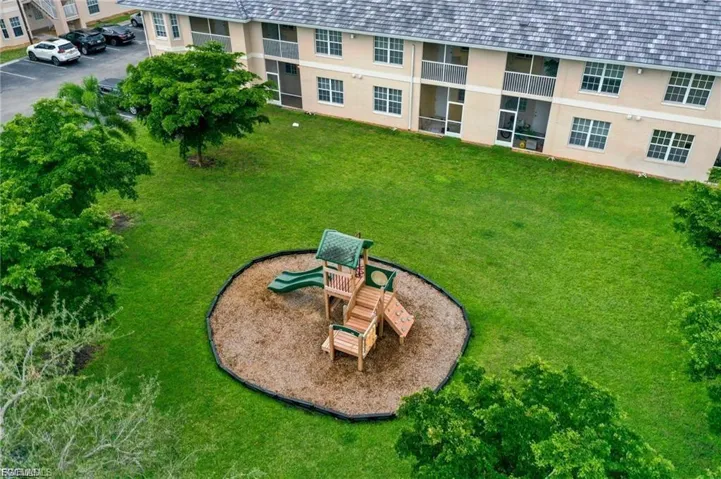 View of property's community featuring a yard