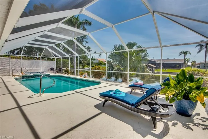 View of swimming pool with a patio area and a lanai