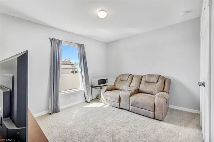 Living area featuring carpet