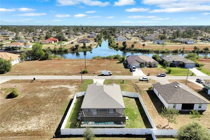 Aerial view of residential area with a large body of water