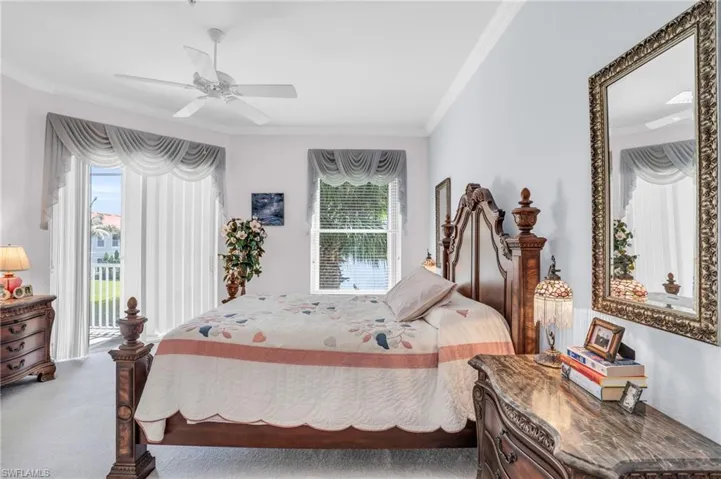 Bedroom featuring ceiling fan, access to outside, carpet floors, and ornamental molding