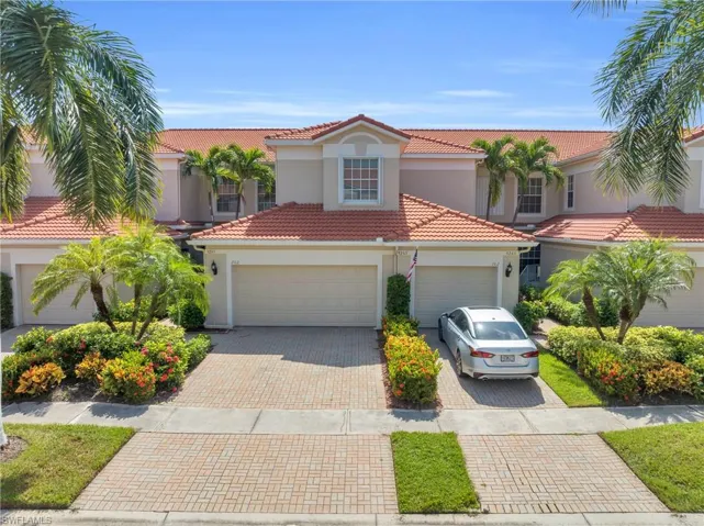 Mediterranean / spanish house featuring a garage