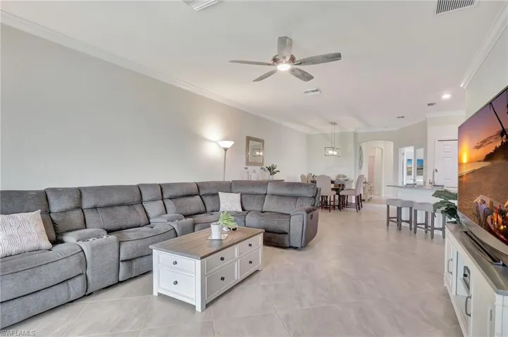 Tiled living room with ceiling fan