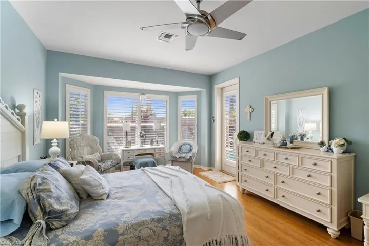 Bedroom featuring light hardwood / wood-style flooring and ceiling fan