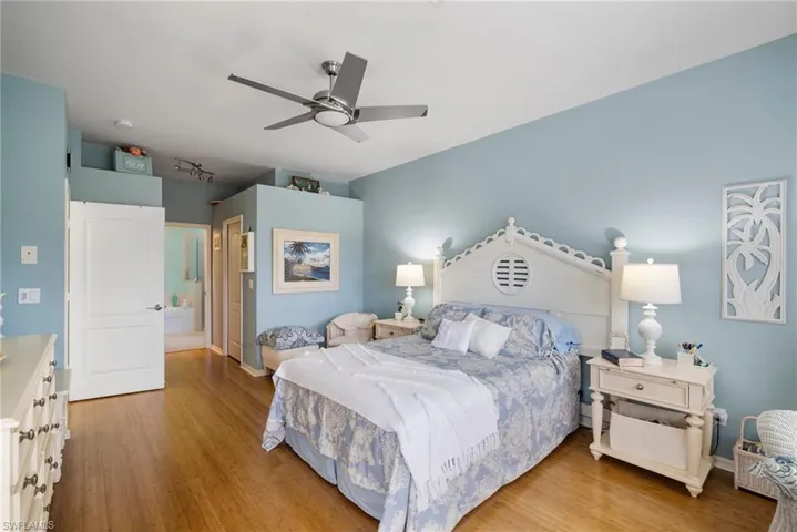 Bedroom featuring ceiling fan and light hardwood / wood-style flooring