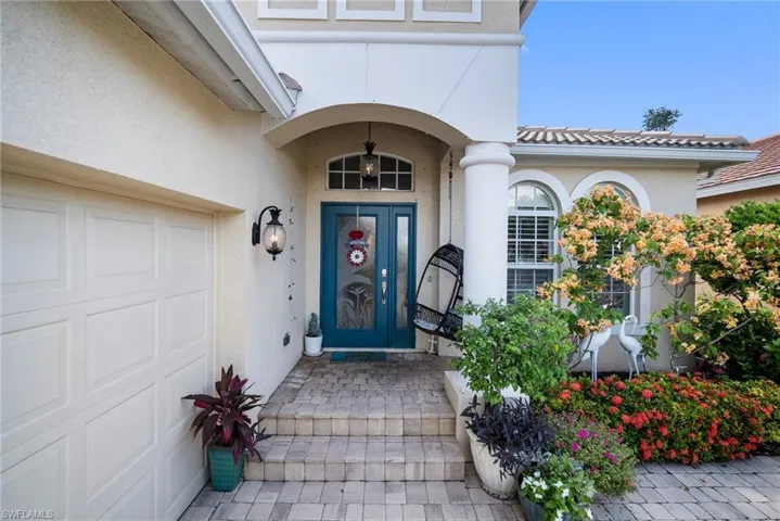 Property entrance featuring a garage
